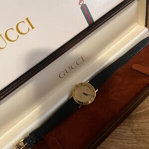 Gucci Black and Gold Watch